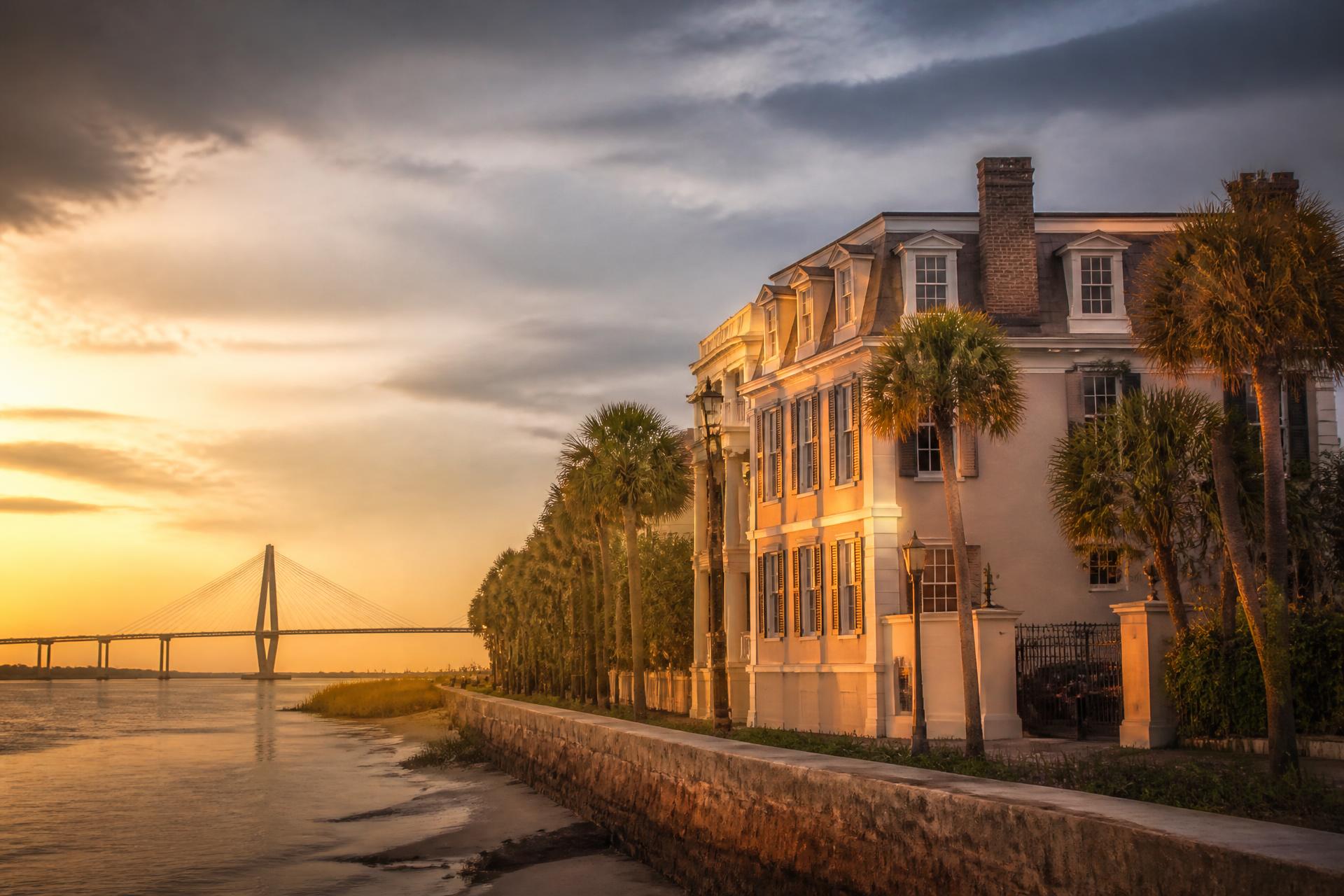 Charleston waterfront home at sunset with the Ravenel Bridge